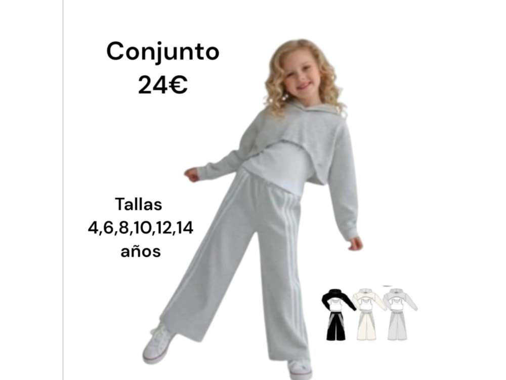 Una niña viste el conjunto de tres piezas en tono gris con el pantalón con raya blanca.